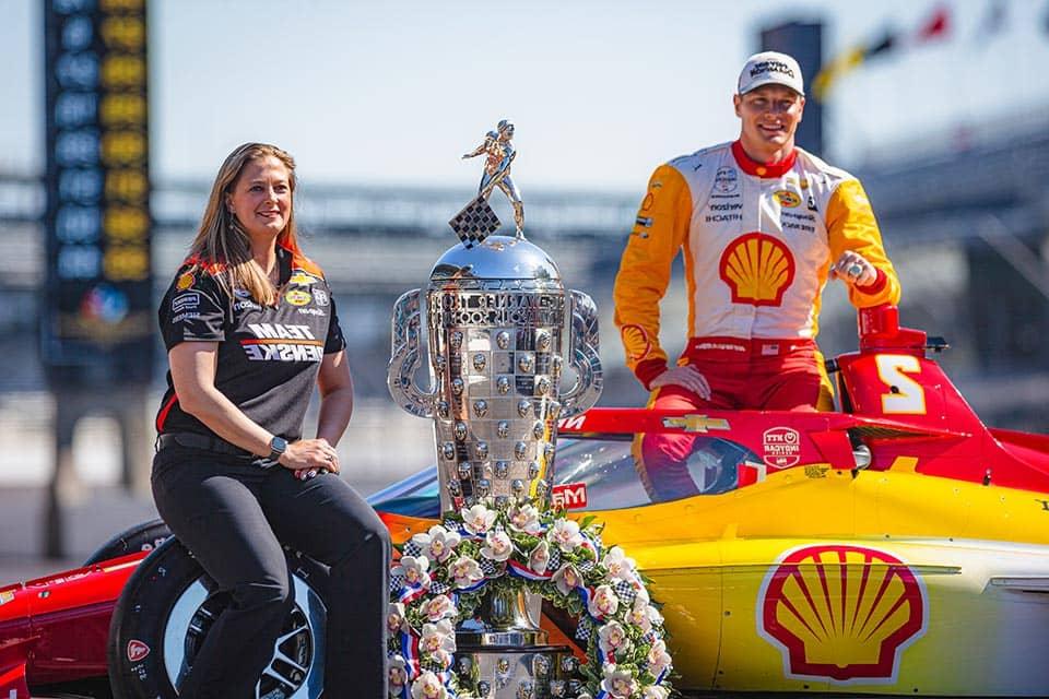 Lauren Sullivan (right) with driver Josef Newgarden and the winning Indy 500 car.